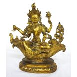 GILT BRONZE HINDU GOD VARUNA seated upon Makara, the half animal half fish,