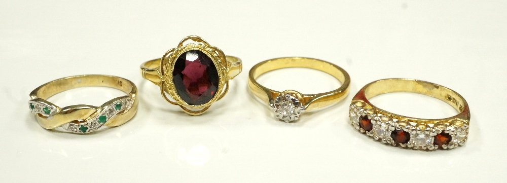 FOUR GEM SET SILVER GILT RINGS of various design,