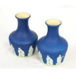 PAIR OF BRITANNIA POTTERY VASES of shaped form with long necks and flared rims,