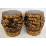 PAIR OF CHINESE GLAZED POTTERY SEATS decorated in relief with dragons and mask handles,