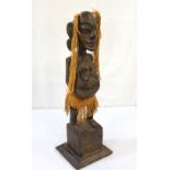 AFRICAN CARVED WOODEN FEMALE FERTILITY FIGURE raised on shaped base,
