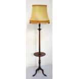 MAHOGANY STANDARD LAMP early 20th century, the turned shaped column with an circular shelf,