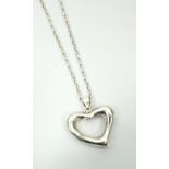 PIERCED SILVER HEART PENDANT on silver chain