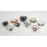 SELECTION OF NINE SILVER RINGS comprising a fire opal five stone ring,