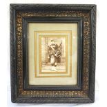 EDWARDIAN PHOTOGRAPH OF A MILITARY PIPER in a heavy carved black oak frame with gilt detailing,