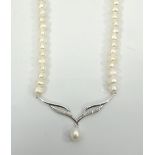 CULTURED PEARL AND DIAMOND NECKLET the front nine carat gold pendant section set with diamonds and