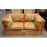 FLORAL PATTERNED TWO SEATER SETTEE 170cm wide, raised on short castor feet,