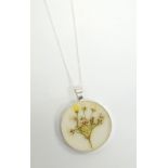 CIRCULAR GYPSOPHILA PENDANT BY BOTANIC ISLES the hand pressed flowers preserved in resin within a