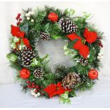 LARGE ARTIFICIAL CHRISTMAS WREATH the spruce and pine wreath decorated with velvet poinsettias,