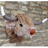 CARAMEL AND CREAM FURRY FAUX TAXIDERMY HIGHLAND COW BY JULIET LEDSON the head with jute fringe,