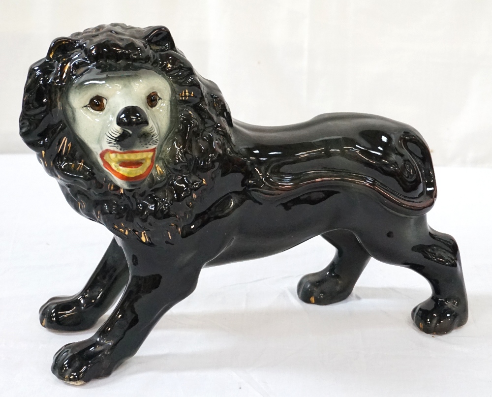 LARGE STAFFORDSHIRE POTTERY LION