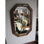 AN OAK FRAMED MIRROR with bevelled glass plate 66cm x 44cm