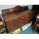 A CHIPPENDALE STYLE MAHOGANY SIDEBOARD the rectangular top with gadrooned rim above three frieze