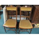 A PAIR OF EDWARDIAN ROSEWOOD AND SATINWOOD OCCASIONAL CHAIRS on turned legs