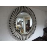 A SILVER AND EBONISED FRAMED MIRROR of circular form 104cm diameter