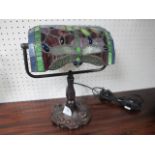 A TIFFANY STYLE ETCHED GLASS TABLE LAMP with multicoloured glass shade above a baluster column on