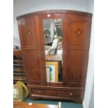 AN EDWARDIAN MAHOGANY INLAID WARDROBE with mirrored door the base containing a drawer