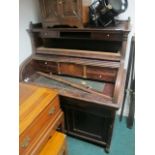 AN AMERICAN WALNUT TAMBOUR FRONT DESK the super structure with moulded three quarter gallery above