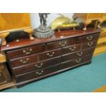 A MAHOGANY LOWBOY the rectangular top above an arrangement of seven drawers on bracket feet 82cm