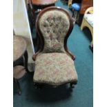 A VICTORIAN MAHOGANY LADIES CHAIR the curved top rail above a button upholstered back and seat on