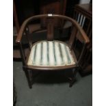 AN EDWARDIAN MAHOGANY AND SATINWOOD INLAID TUB SHAPED CHAIR on square tapering legs