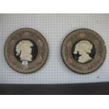 A PAIR OF CONTINENTAL PORCELAIN PLAQUES each moulded in relief with figural panels 30cm diameter