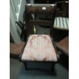 A REGENCY MAHOGANY SIDE CHAIR the curved top rail above an upholstered drop in seat on sabre legs