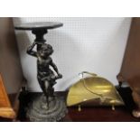 A COMPOSITION FIGURAL JARDINIERE STAND together with a Dutch brass fuel carrier