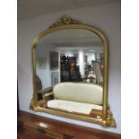 A VICTORIAN STYLE GILT FRAME OVERMANTEL MIRROR the rectangular arched plate within a moulded frame