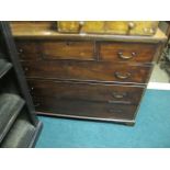 A GEORGIAN MAHOGANY CHEST of two short and three long graduated drawers on bracket feet 90cm (h) x