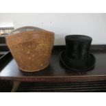 A TOP HAT in original leather case inscribed "Lincoln Bennett and Company Limited"