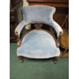 AN EDWARDIAN MAHOGANY TUB SHAPED CHAIR with upholstered back and seat on cabriole legs