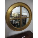 A CONTINENTAL GILT FRAME COMPARTMENT MIRROR of oval outline with beadwork decoration 79cm diameter