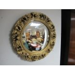 A CONTINENTAL CONVEX MIRROR with foliate moulded frame 46cm diameter together with a rectangular