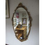 A CONTINENTAL GILT FRAME MIRROR of oval bevelled glass plate foliate and rope frame 75cm (h) x 40cm