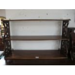 AN EDWARDIAN MAHOGANY THREE TIER WALL SHELF 49cm (h) x 82cm (w) x 23cm (d)