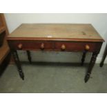 A VICTORIAN MAHOGANY TWO DRAWER SIDE TABLE on turned legs 72cm (h) x 105cm (w) x 30cm (d)
