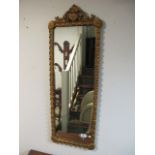 A CONTINENTAL GESSO MIRROR the rectangular plate within a foliate moulded frame and flowerhead and