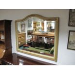 A GEORGIAN STYLE OVERMANTEL MIRROR the moulded frame with foliate cartouche and bevelled plate 97cm