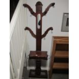 A VICTORIAN MAHOGANY COAT TREE with hinged compartment on platform base 190cm(h) x 64cm (w) x 27cm