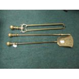 A SET OF THREE BRASS FIRE IRONS comprising poker,