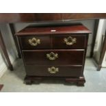 A GEORGIAN STYLE MAHOGANY CHEST of three long graduated drawers on ogee bracket feet 63cm (h) x