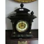 A BLACK PAINTED MANTLE CLOCK in classical form with simulated marble columns white enamel dial and