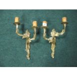 A PAIR OF BRASS TWO BRANCH WALL SCONCES with foliate decoration