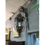 A PAIR OF CONTINENTAL STYLE OCTAGONAL SHAPED LANTERNS the wall mount scrolled support decorated