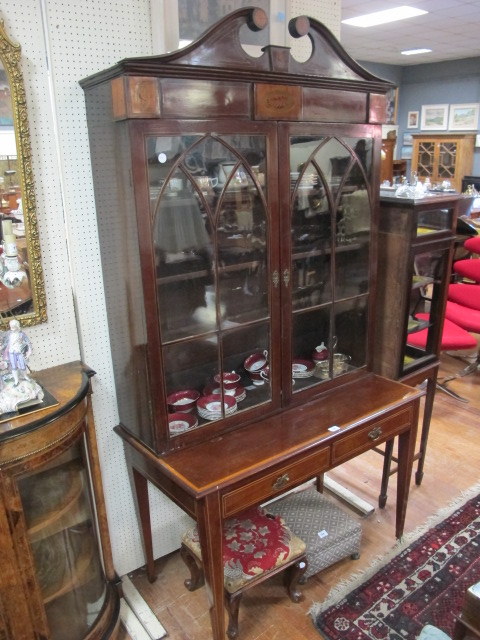 A MAHOGANY AND MARQUETRY INLAID DISPLAY CASE early 19th century the broken arched pediment