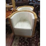 A PAIR OF BURR WALNUT VENEERED ART DECO STYLE TUB SHAPED ARM CHAIRS the shaped frames fitted with