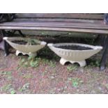 A PAIR OF BOAT SHAPED CREAM CAST IRON PLANTERS raised on shaped supports each 21cm x 57cm