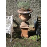 A PAIR OF VICTORIAN STYLE TERRACOTTA CAMPANA SHAPED JARDINIERES gadrooned rims above a foliate