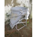 A GREY PAINTED WROUGHT IRON CONCRETE MIXER ON TUBULAR STANDS 97cm x 85cm